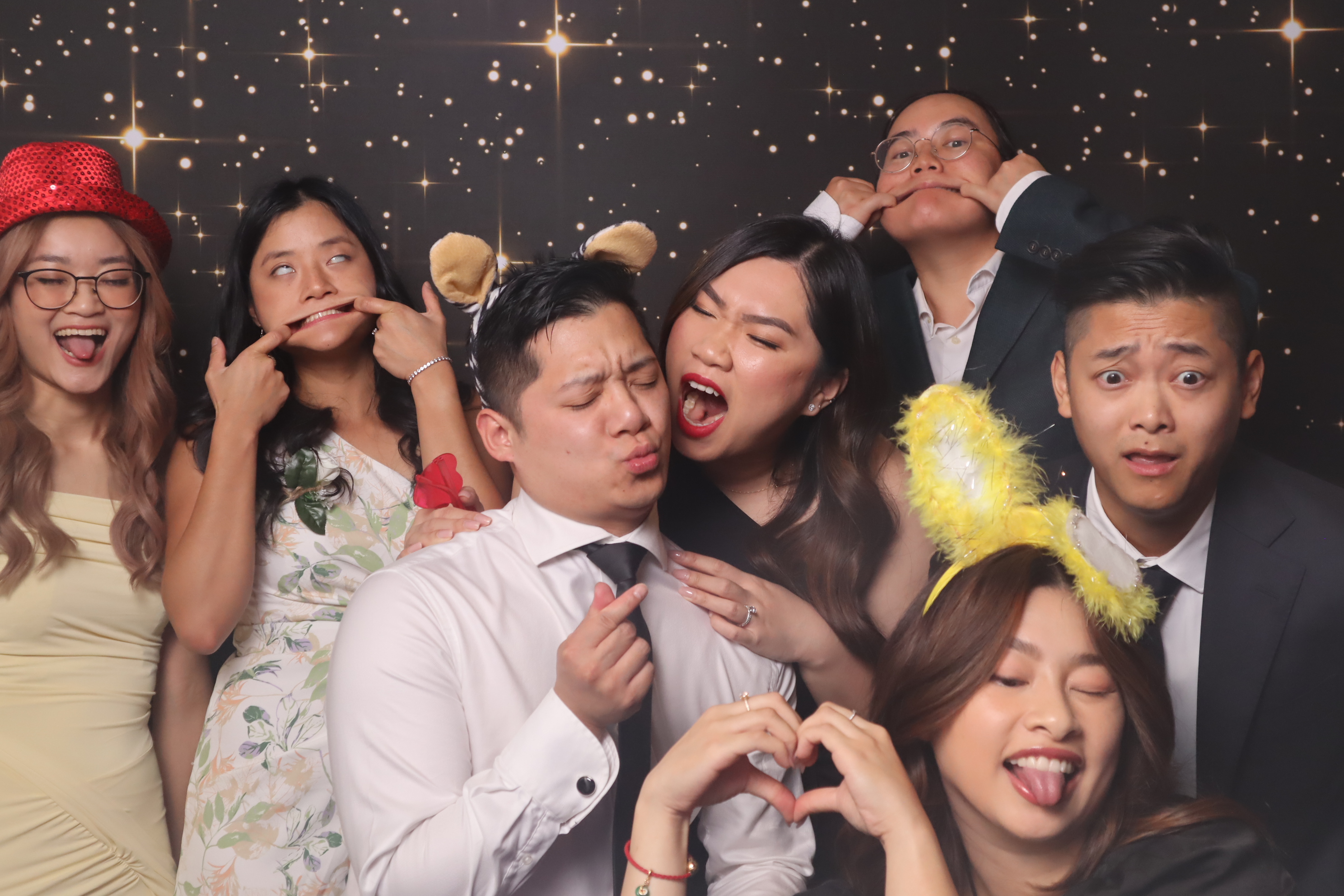 Fun group at photobooth with props